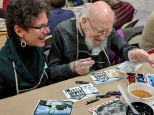 Hanna and Rainer participate in an Artful Afternoon workshop.