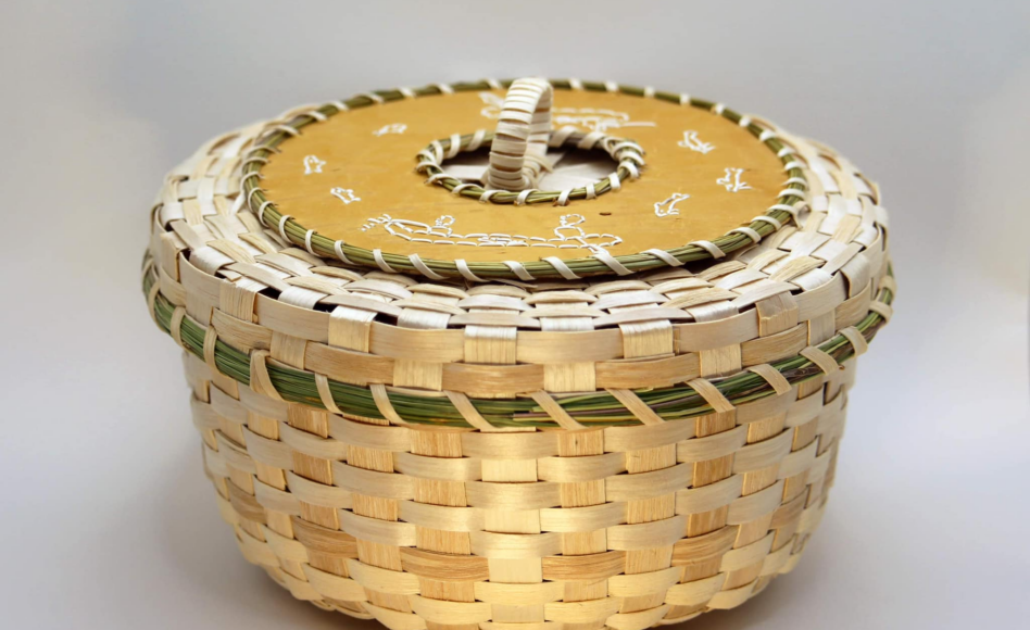 a woven basket sits on a white background