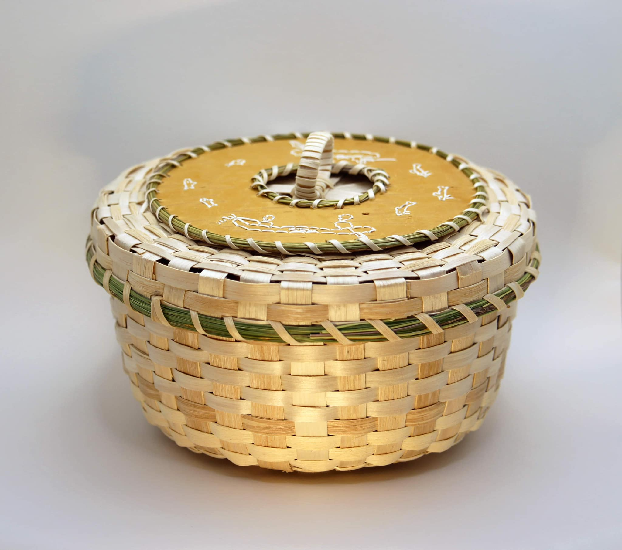 a woven basket sits on a white background