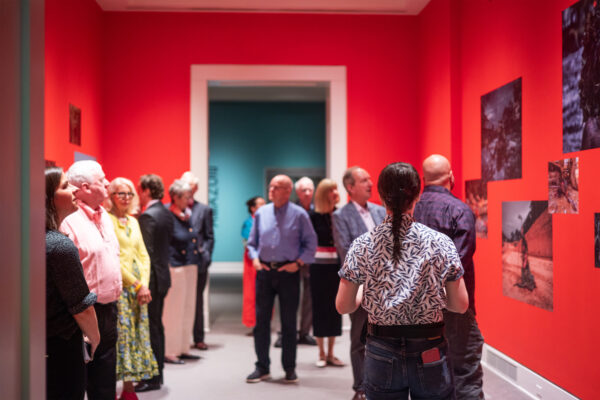 Crowd of people standing in art gallery of nova scotia exhibition