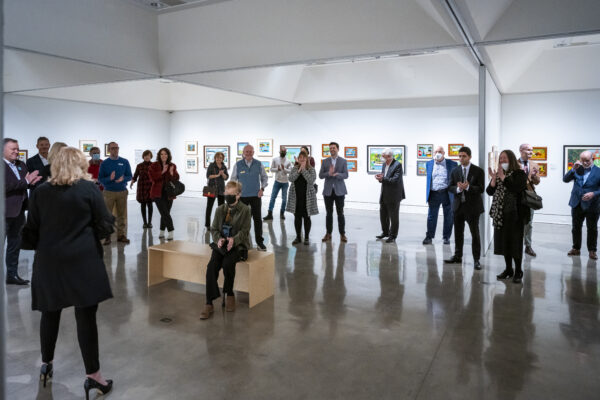 Crowd of people listen to Art Gallery of Nova Scotia CEO at Patron Preview