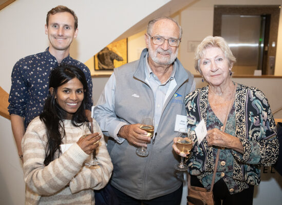 Four people posing for photo