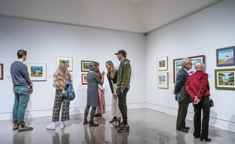 Several people looking at art in the Art Gallery of Nova Scotia