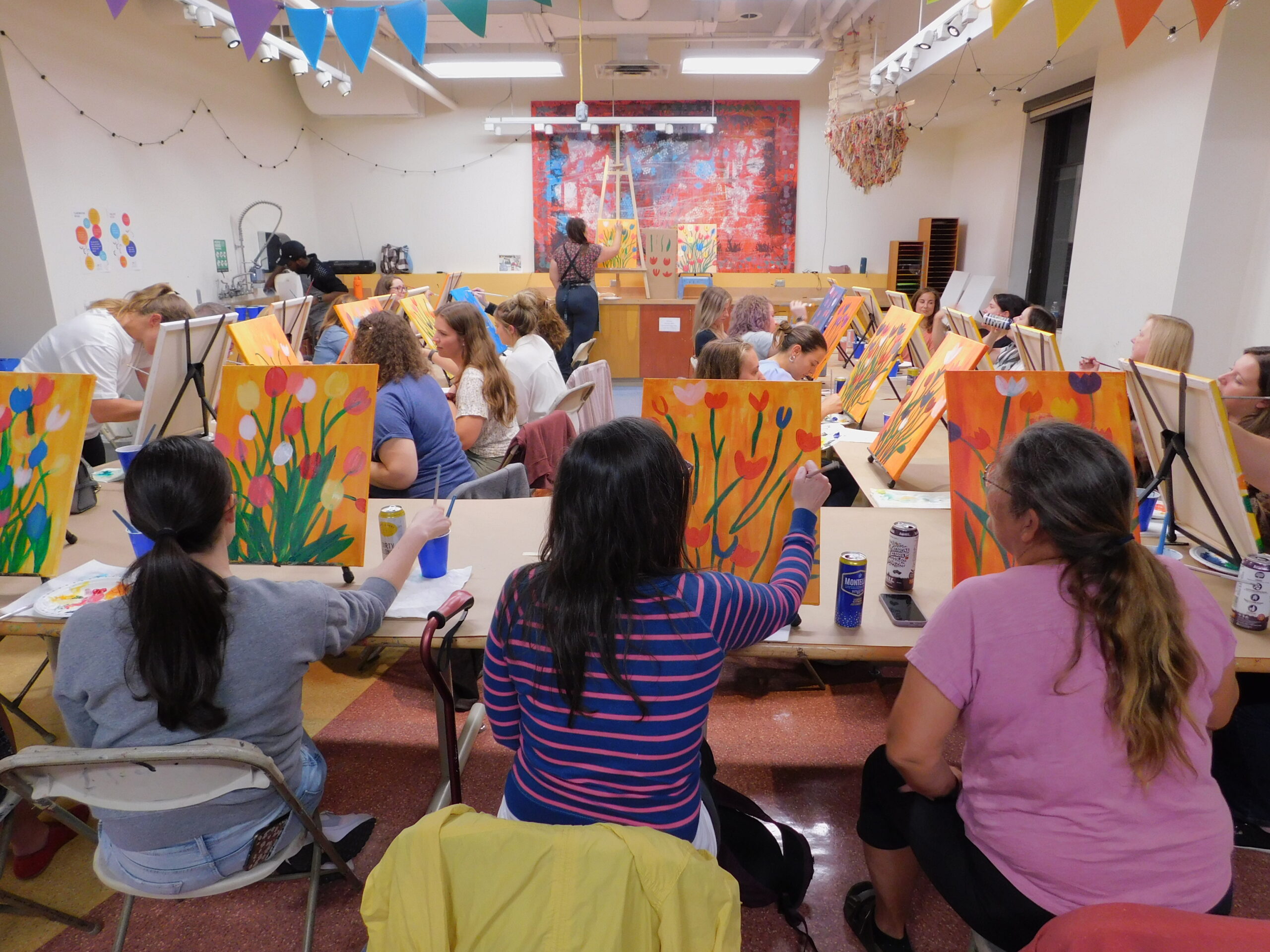 Adults painting in a group