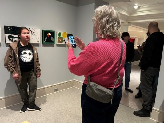 kids in an art gallery space looking at art